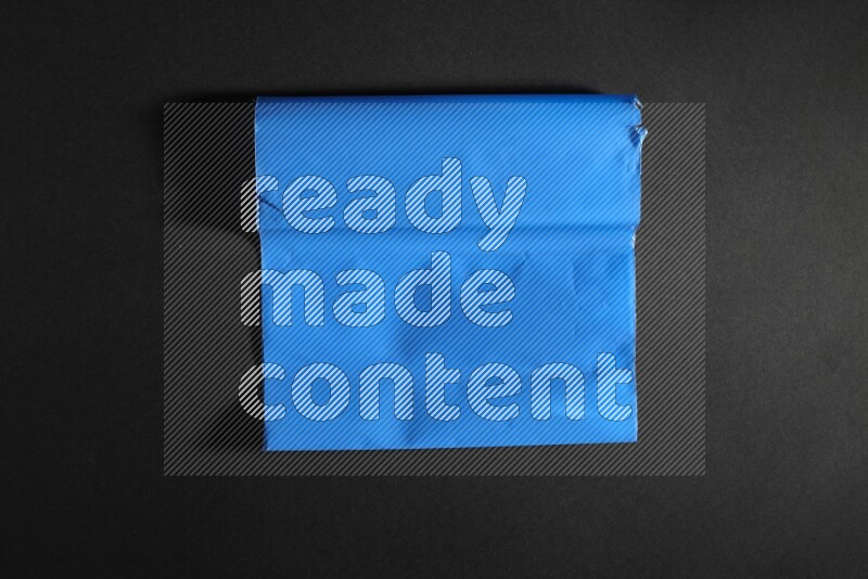 Colored plastic textures on black background