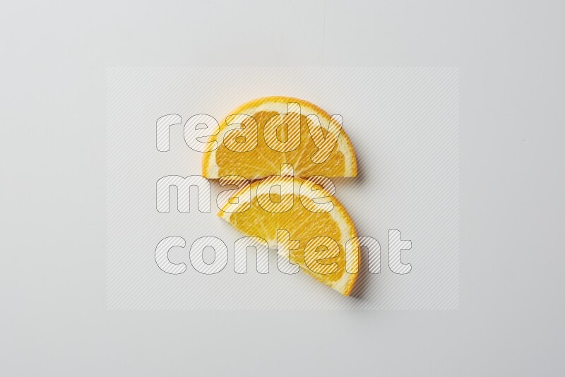 Two halves of an orange slices on white background