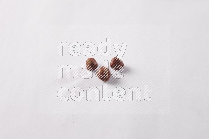 Hazelnuts on white background