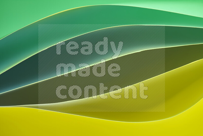 This image showcases an abstract paper art composition with paper curves in green and yellow gradients created by colored light