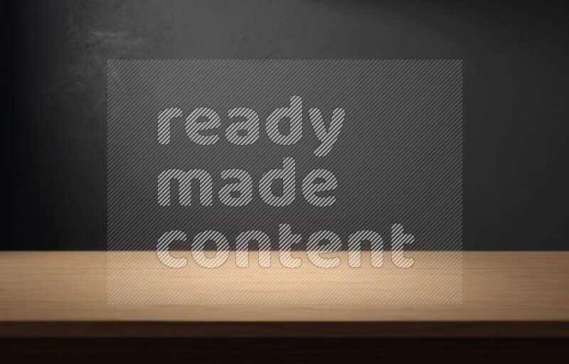 A wooden table top with colored textured wall background