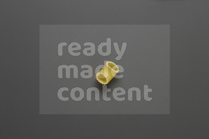 Elbow pasta on grey background