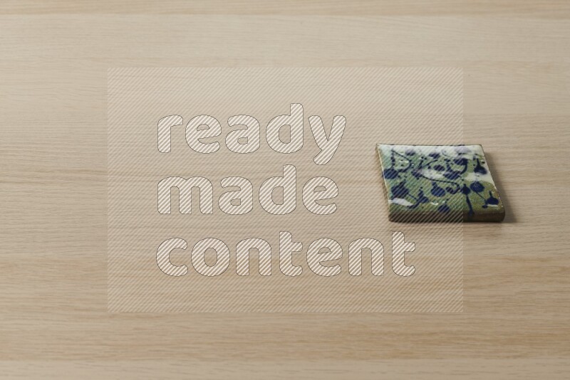 A decorative coaster on light wooden background