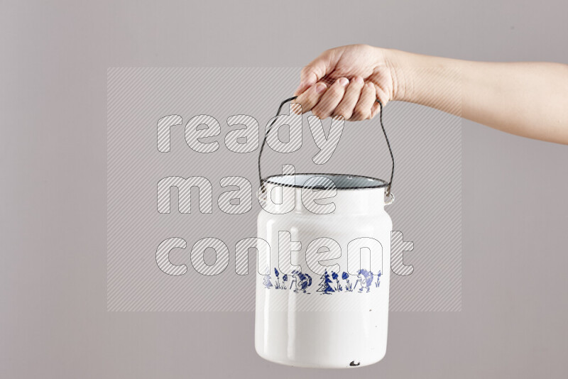 Woman hands holding different metal essentials in different positions