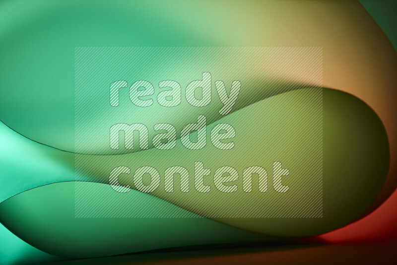 An abstract art piece displaying smooth curves in green and orange gradients created by colored light