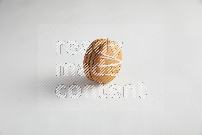 45º Shot of Brown Irish Cream macaron on white background
