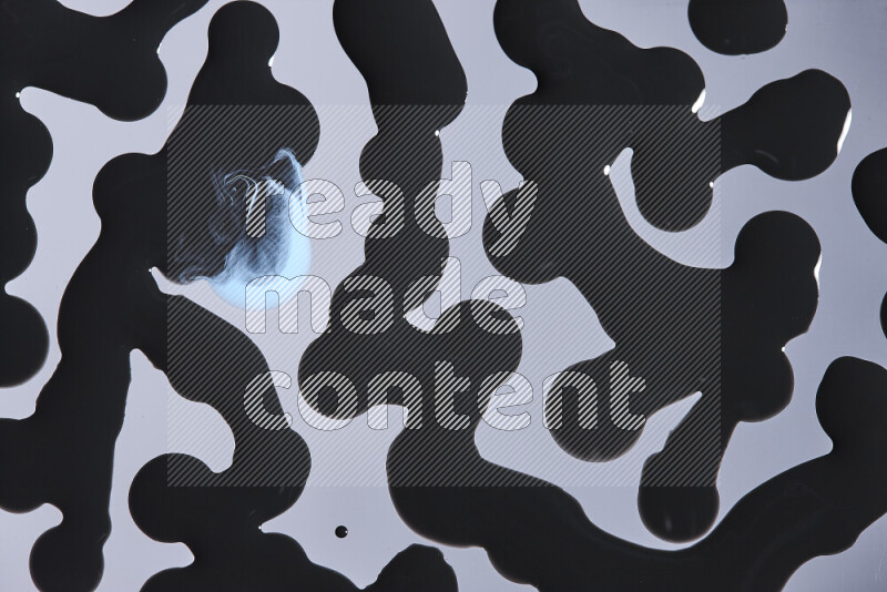 خلفية ملونة مع مزيج من ألوان الطلاء الأزرق والاسود