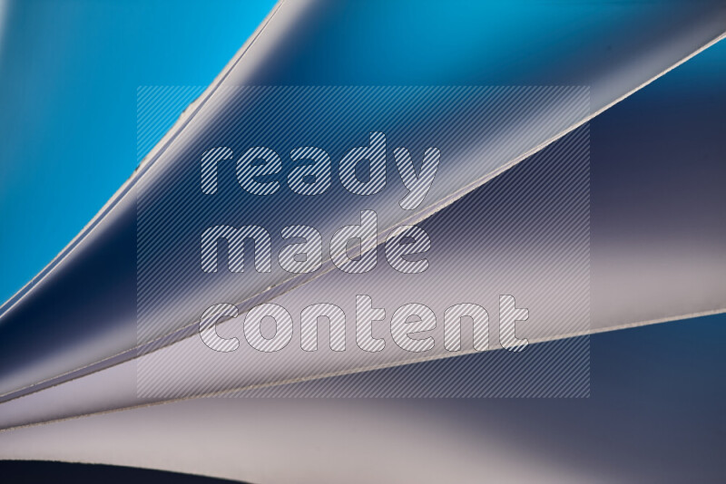 An abstract art piece displaying smooth curves in cold gradients created by colored light