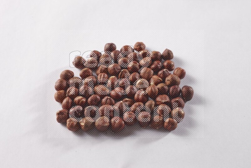 Hazelnuts on white background