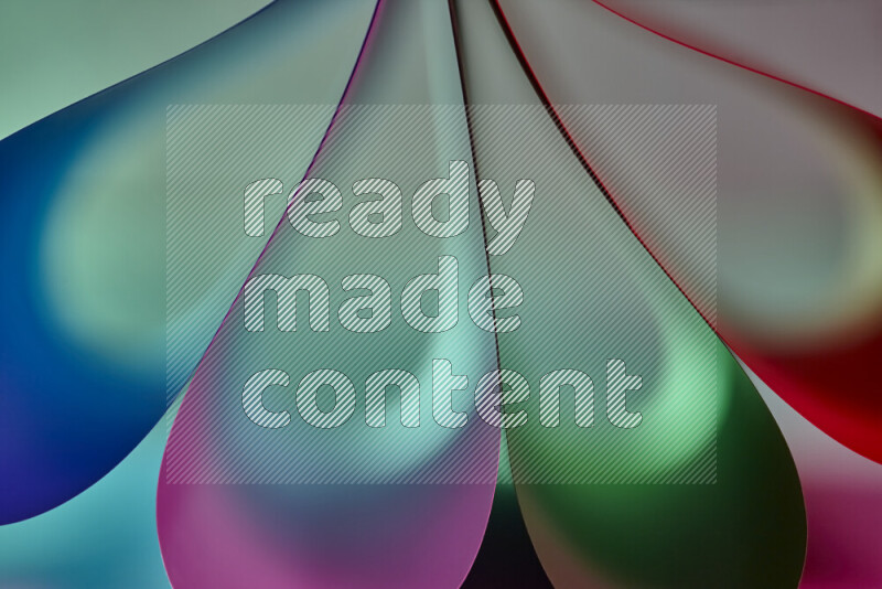 An abstract art piece displaying smooth curves in colorful gradients created by colored light