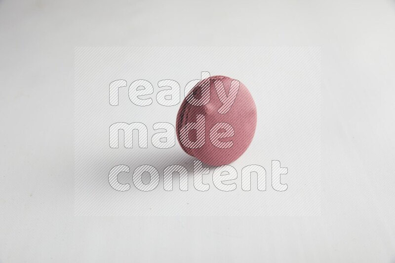 45º Shot of Red Cherry macaron on white background