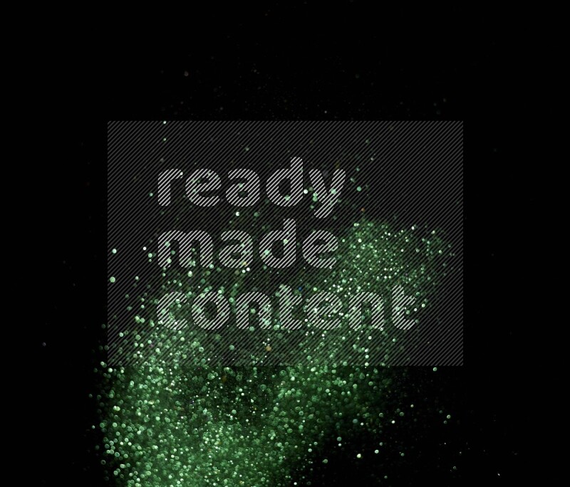 Green glitter powder isolated on black background