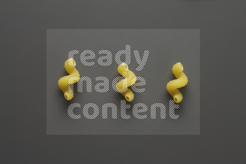 Twist pasta on grey background