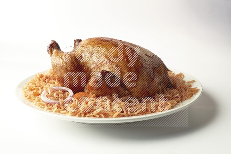 red basmati Rice with  whole roasted chicken on a white rounded plate  direct  on white background