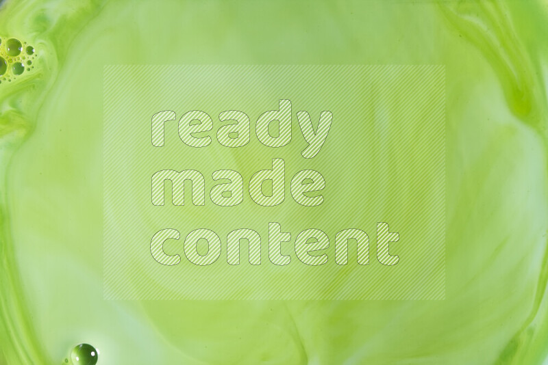 A close-up of abstract swirling patterns in green gradients