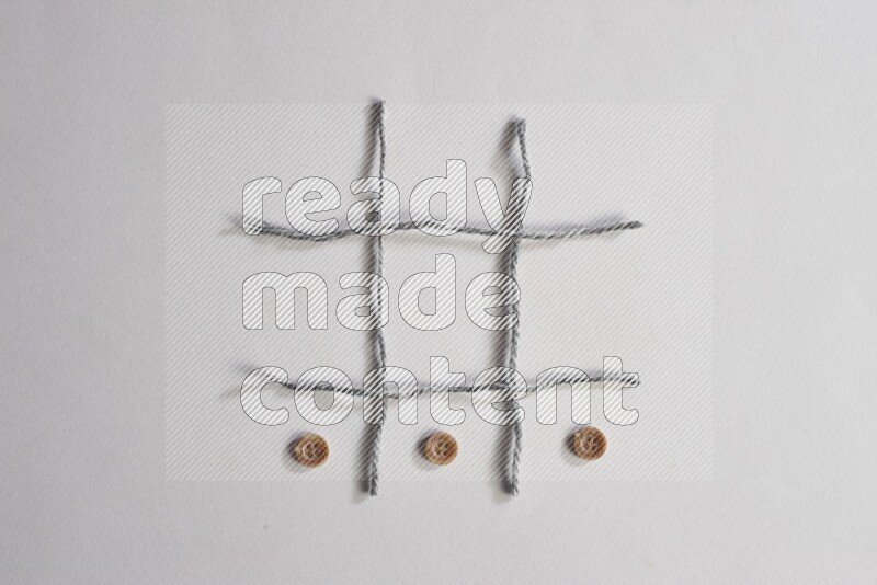 Brown buttons placed on grey background