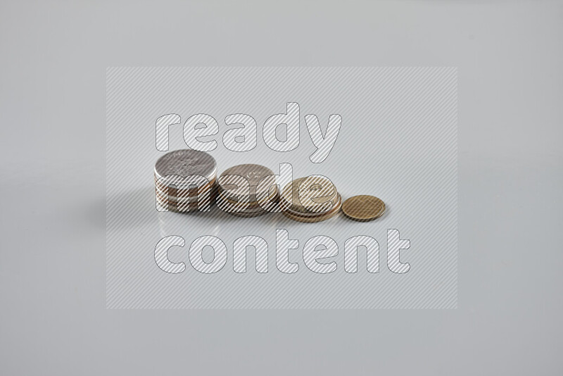 Random old coins on grey background