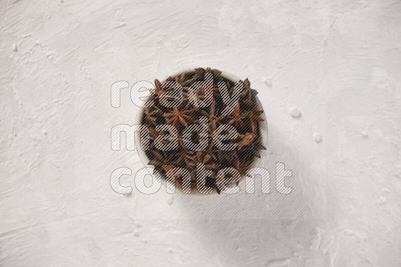 Star Anise in a white bowl on white background