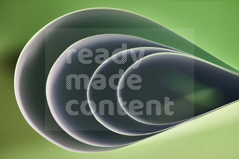 An abstract art of paper folded into smooth curves in green gradients
