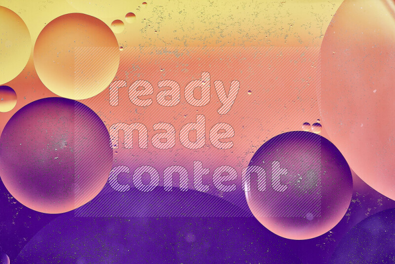 Close-ups of abstract oil bubbles on water surface in shades of yellow, orange and purple