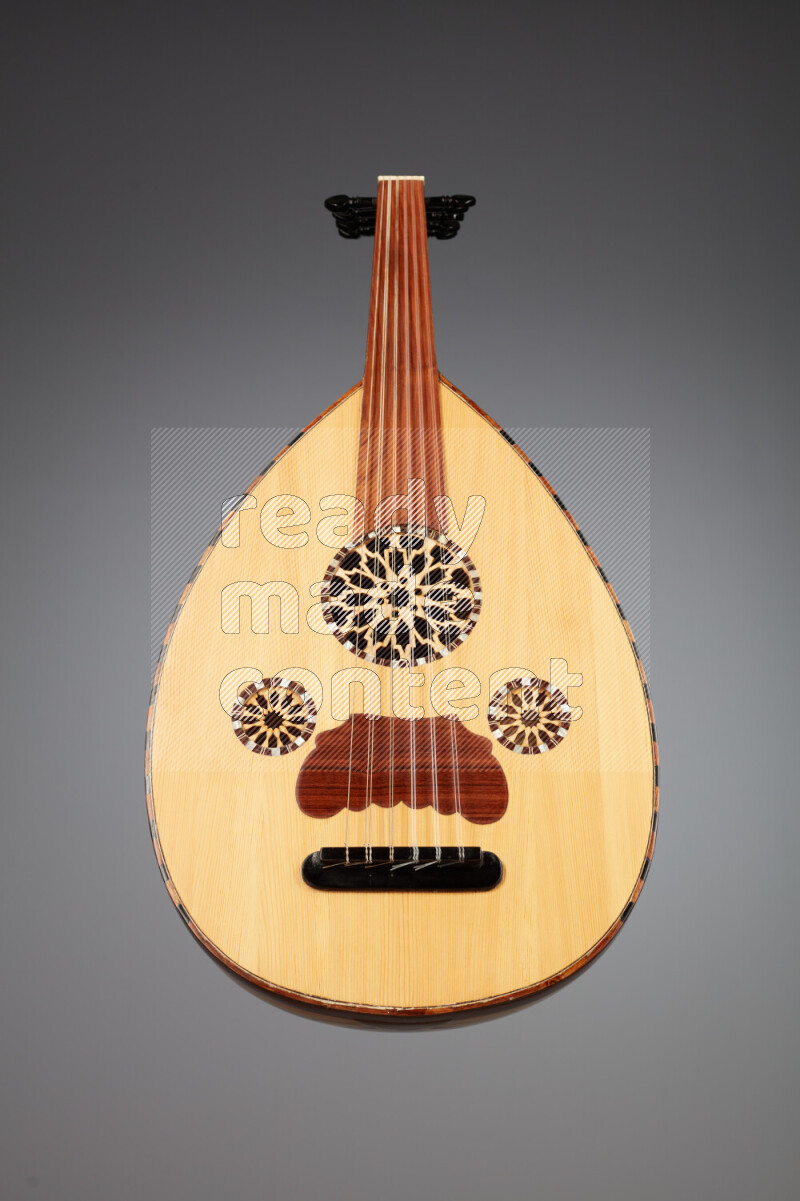 a wooden brown Oud on a gray background