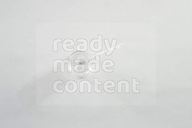 Glassware such as coffee pot, cup, saucer and jar on white background