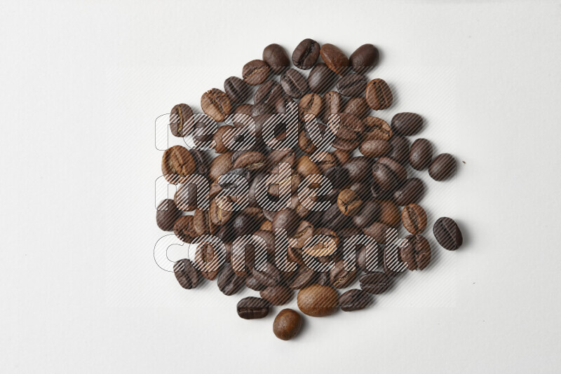 Roasted coffee beans on white background