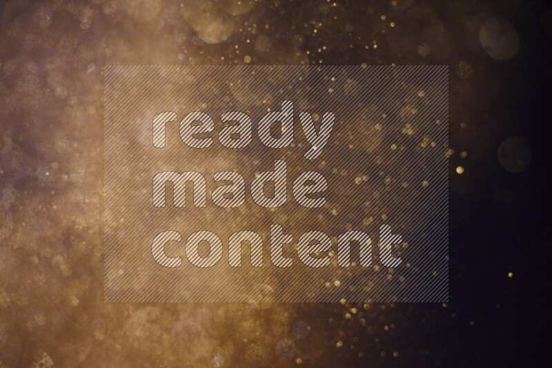 Gold glitter powder isolated on black background