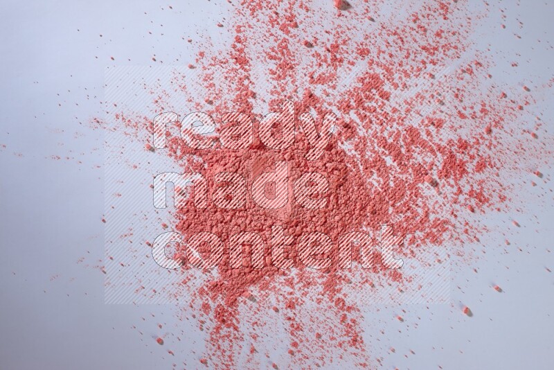 Red powder on white background