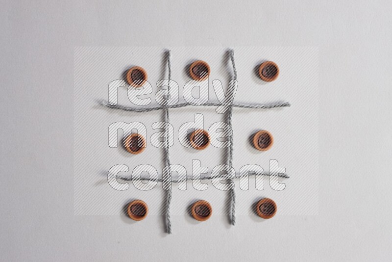 Wooden buttons placed on grey background