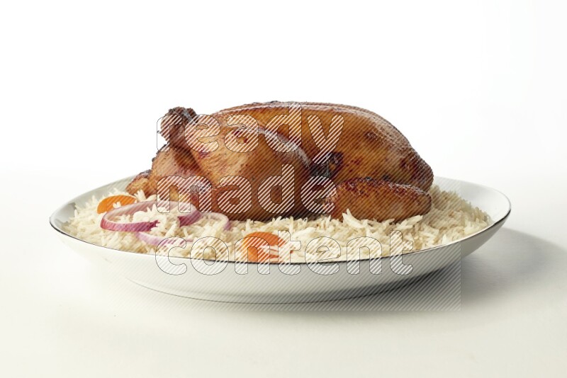 white  basmati Rice with  whole roasted chicken  on a white plate with a silver rim direct  on white background