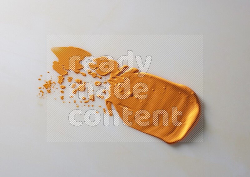 An orange straight painting knife stroke on white background