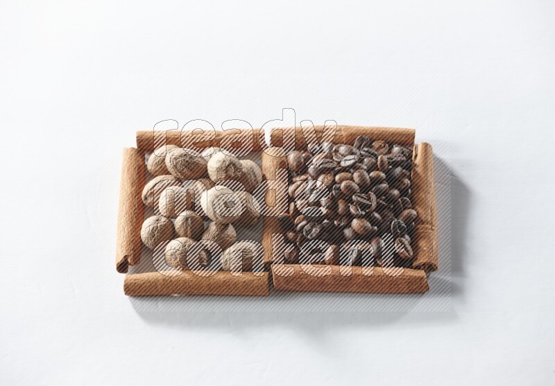 2 squares of cinnamon sticks full of coffee beans and nutmegs on white flooring