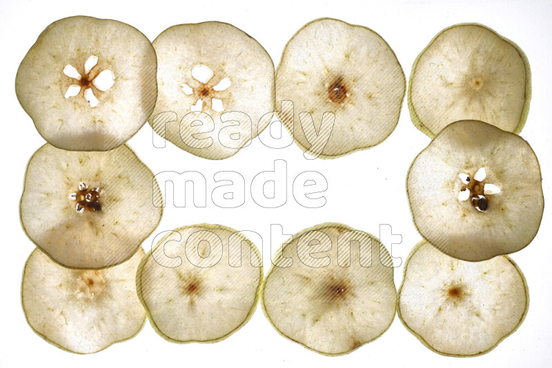 Pear slices on illuminated white background