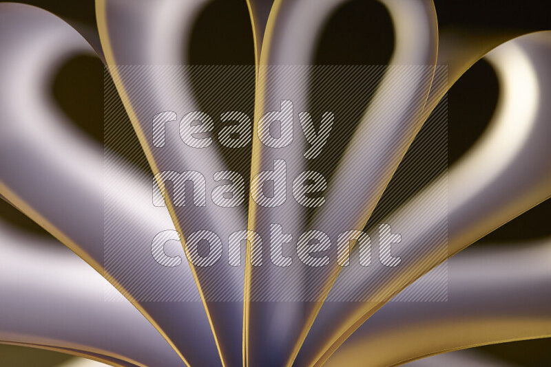 An abstract art piece displaying smooth curves in white and yellow gradients created by colored light