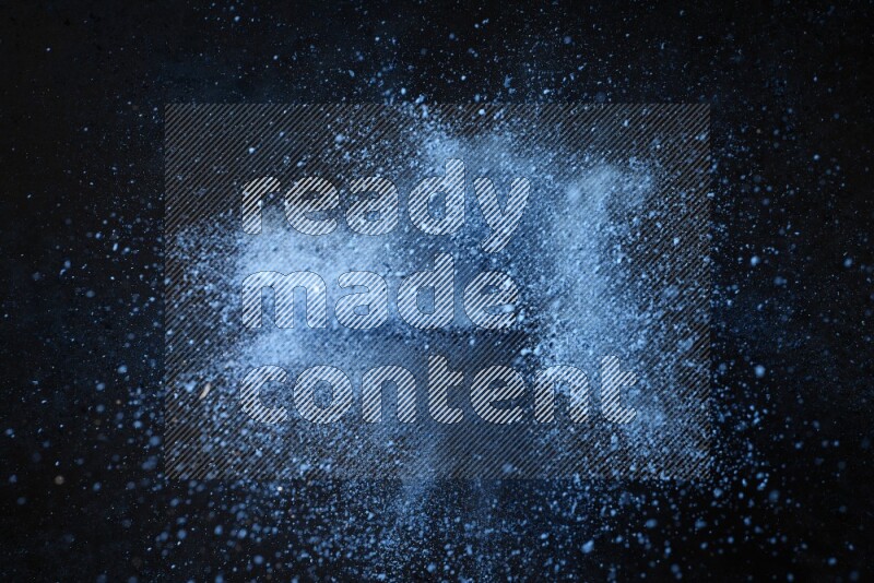 Blue powder explosion on black background