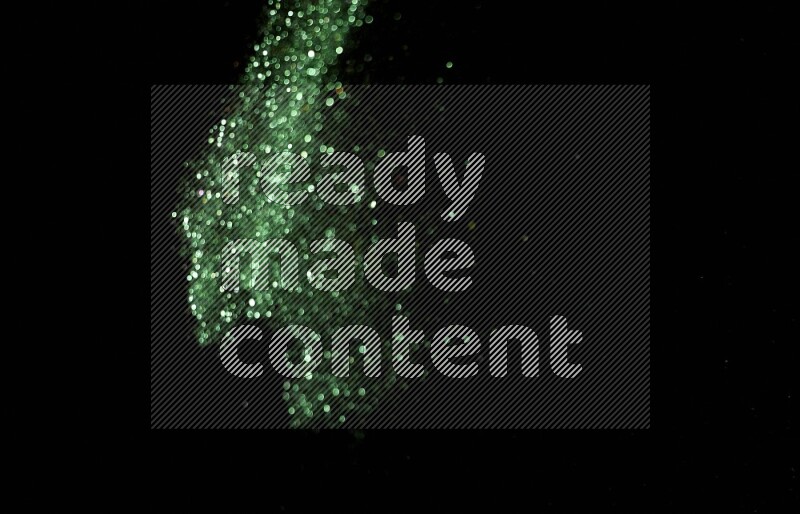 Green glitter powder isolated on black background