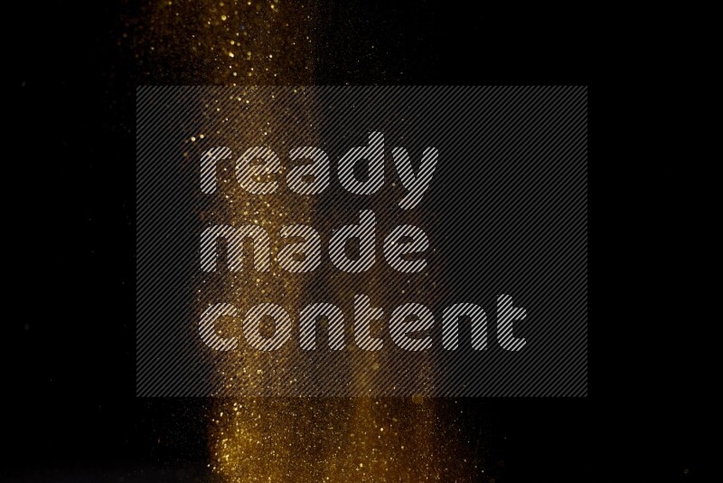 Gold glitter powder isolated on black background