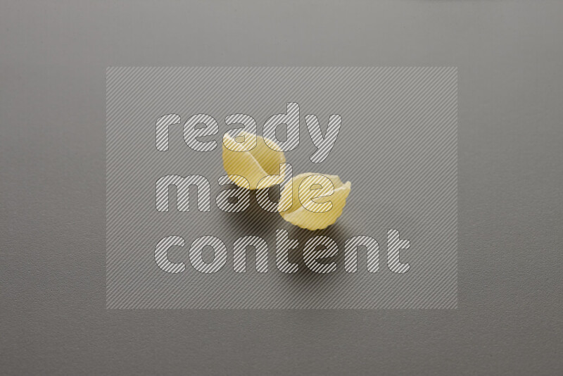 Shells pasta on grey background