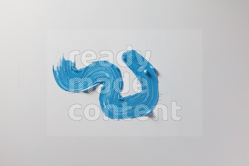 A single blue zigzag brush stroke on a white background