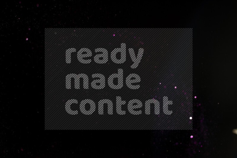 Pink glitter powder isolated on black background