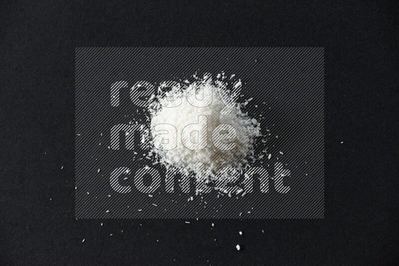 Desiccated coconut on a black background in different angles