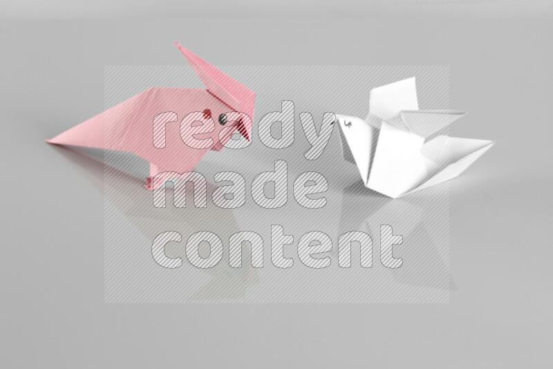 Origami animals on grey background