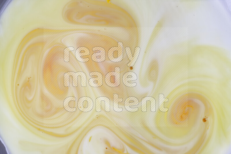 A close-up of abstract different swirling patterns in orange