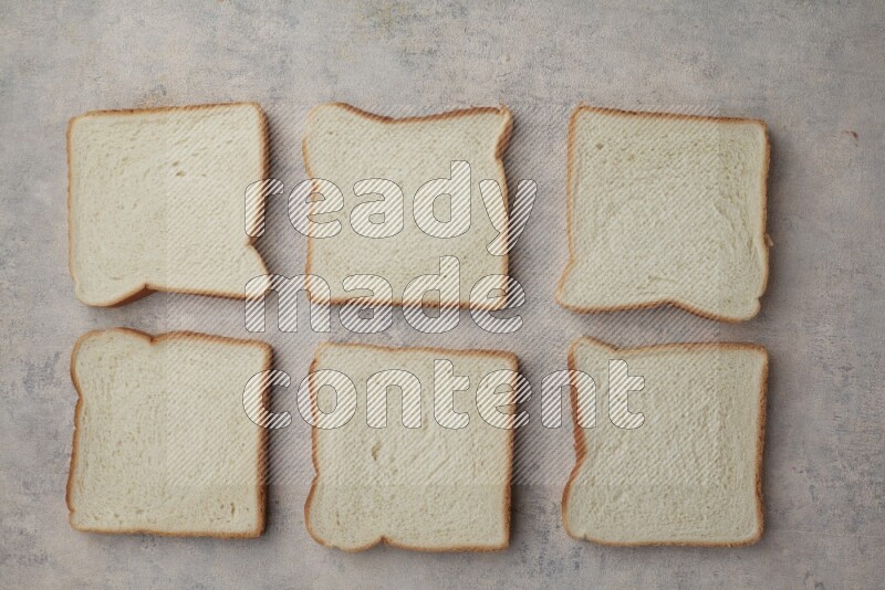 White Toast slices on alight blue textured background