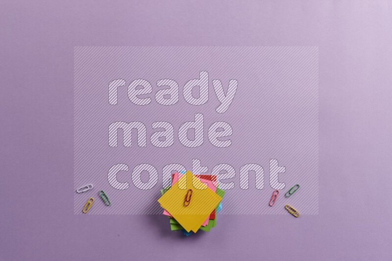 Multicolored sticky notes with school supplies on purple background