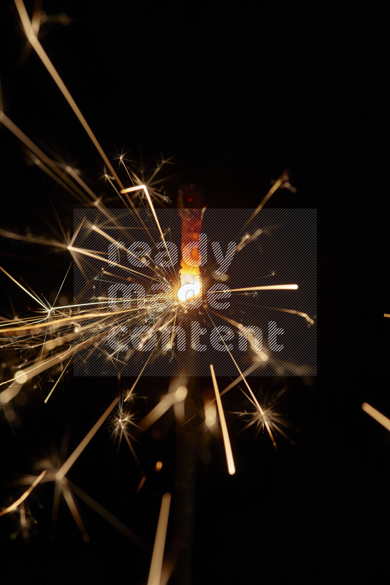 A close-up image of sparkler candle isolated on black background