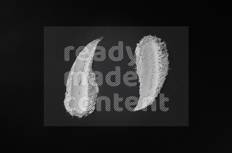 Blue powder smears on black background