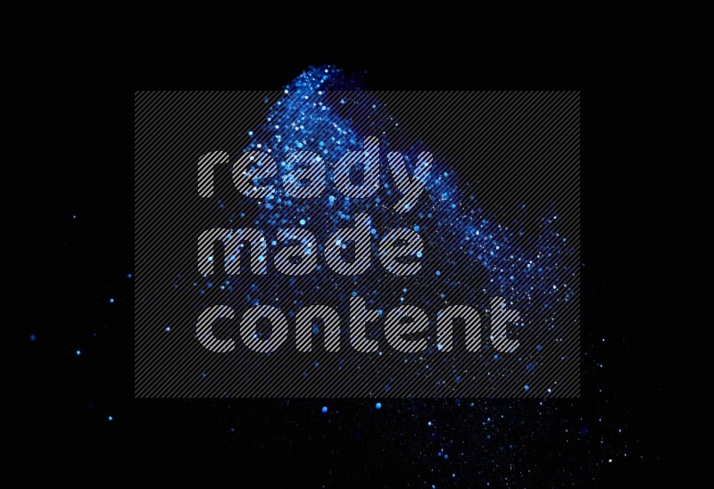 Blue glitter powder isolated on black background
