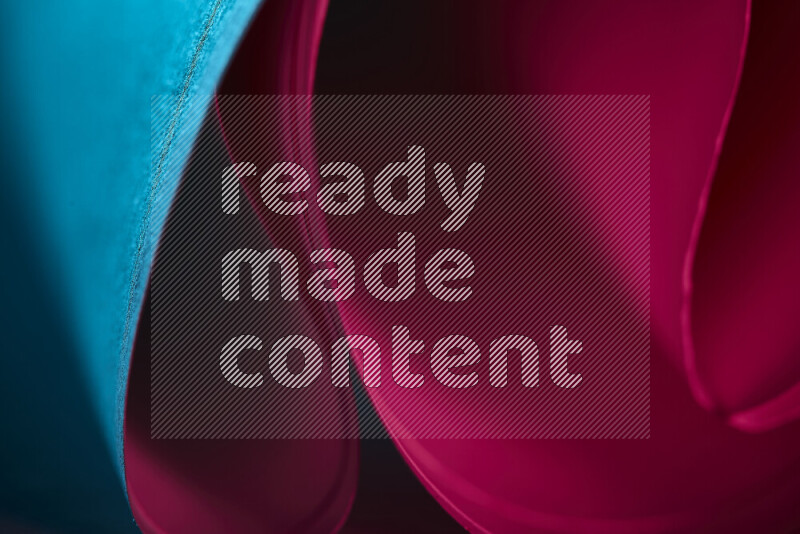 An abstract art piece displaying smooth curves in blue and red gradients created by colored light